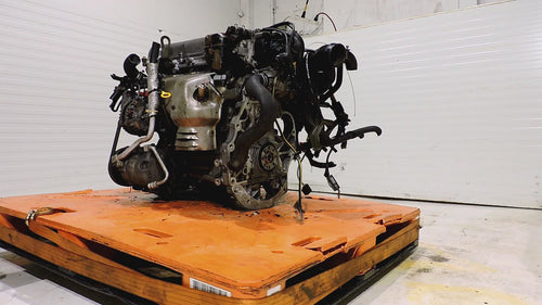 JDM SR18DE 1.8L engine long block for Nissan Sentra 1990-1993 on an orange pallet.